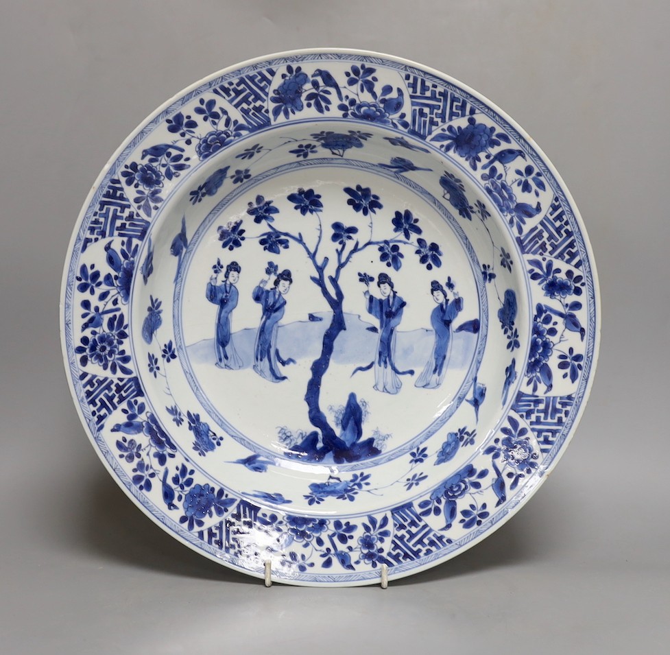 A Chinese blue and white ‘ladies’ basin, Kangxi period, cracked 34cm